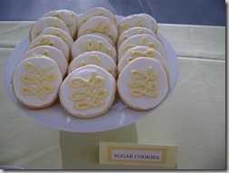 round white sugar cookies with a yellow swirl of frosting