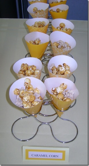 yellow paper cones with caramel corn in them
