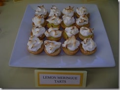 mini lemon meringue tarts on a square white plate