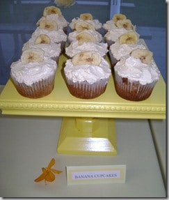 banana cupcakes on a yellow cake stand