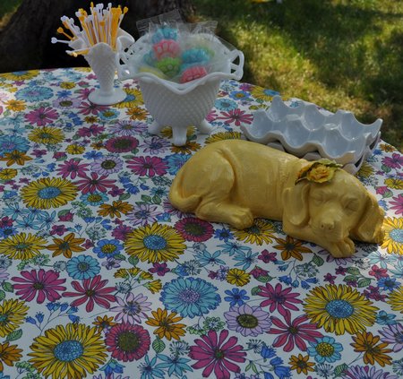 Puppy Dog Party Decorations: pretty pastel banners and buntings made from paper doilies, sweet paper lanterns, and floral table cloths make for a girly vintage inspired puppy dog party.