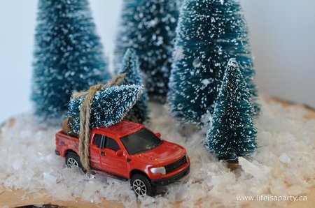 red toy truck with Christmas tree