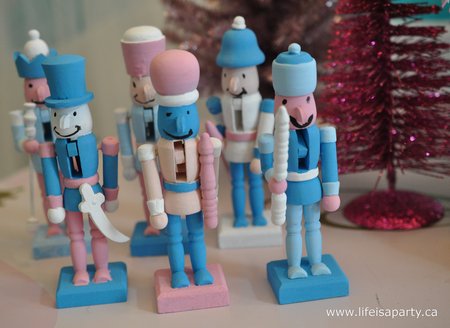 Nutcracker Themed Christmas Decorations: A little mouse army, and mouse king, paper snowflake ballerinas, and pastel coloured nutcrackers make for the perfect Nutcracker themed children's room.