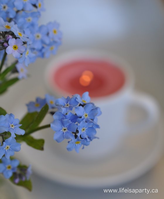 teacup candle and flowers
