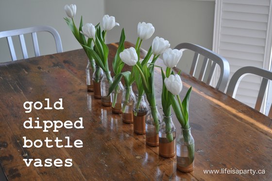 DIY Gold Dipped Vase: use old juice bottles and spray paint to create beautiful gold dipped vases.  Perfect for entertaining. 