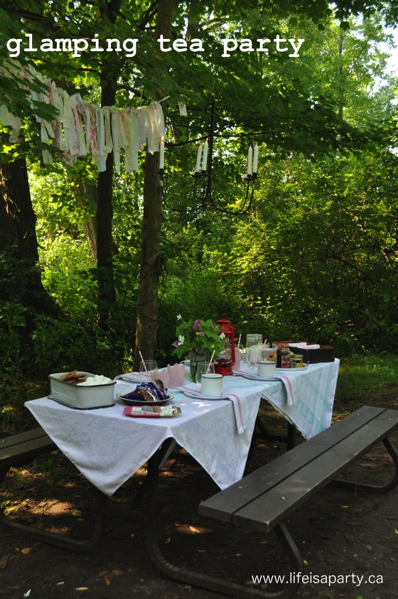 Forest Tea Party: tea and scones all set up in the woods with fun glamping camping accessories, and a camping inspired menu.