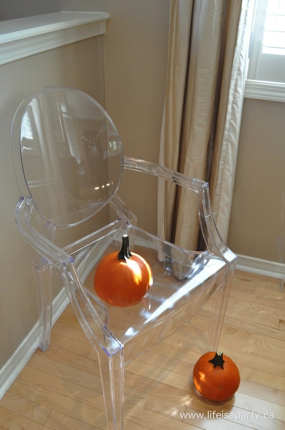 pumpkins on a clear ghost chair