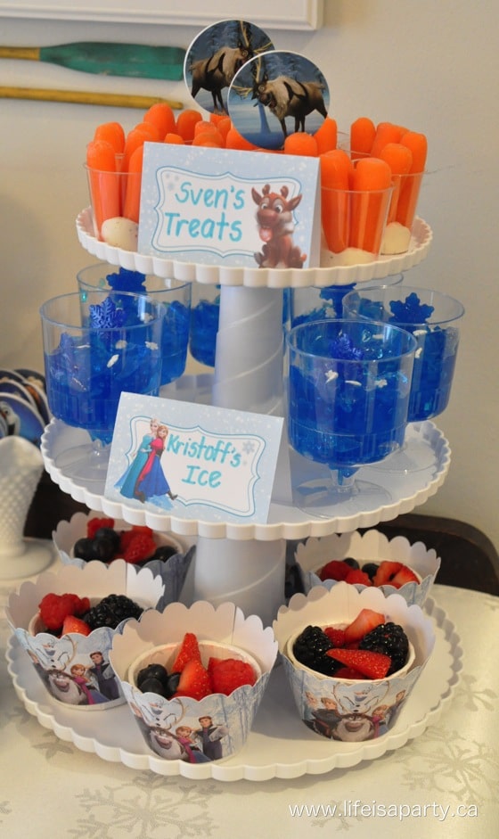 Frozen party food snacks on a three tiered tray.