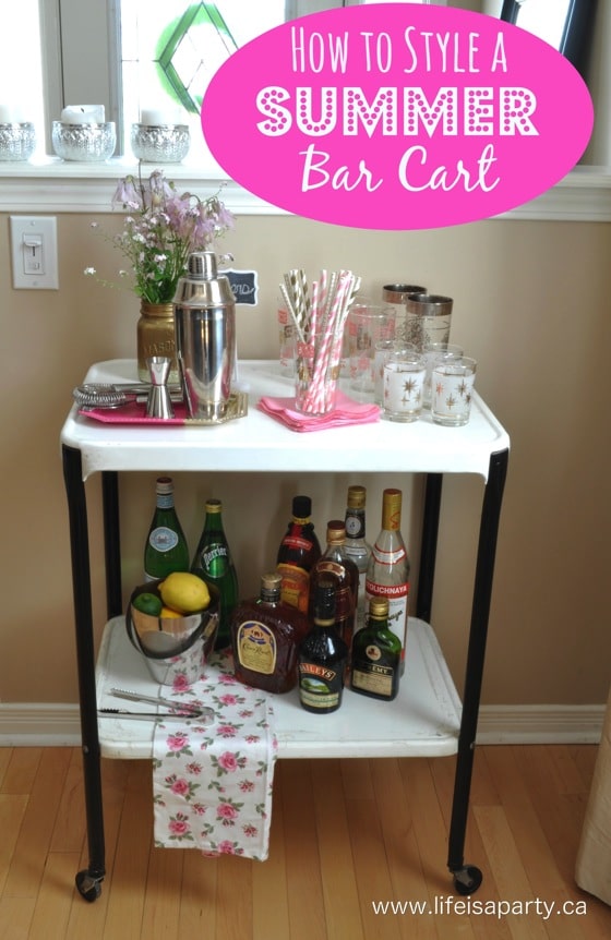 How To Style A Bar Cart: all the essentials like glasses, bar tools, alchol, sparkling water, ice, and few pretty flowers and decor pieces.