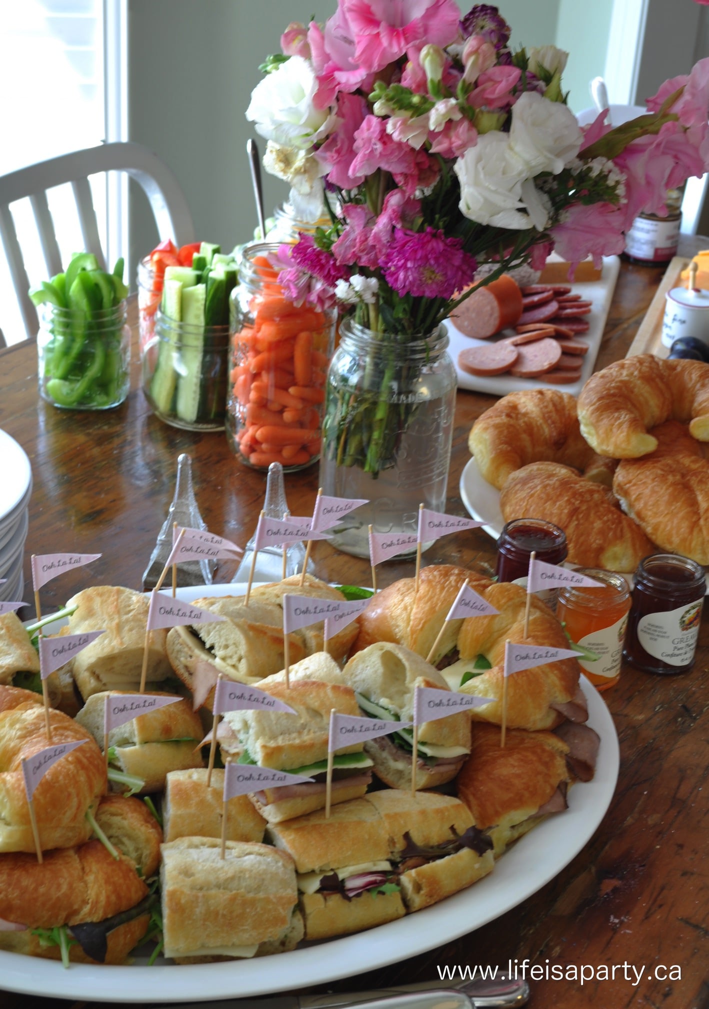 Paris Party Food -A French Themed Menu Great ideas of what to serve at your Paris themed party, from baguettes to macarons! Beautiful and delicious!