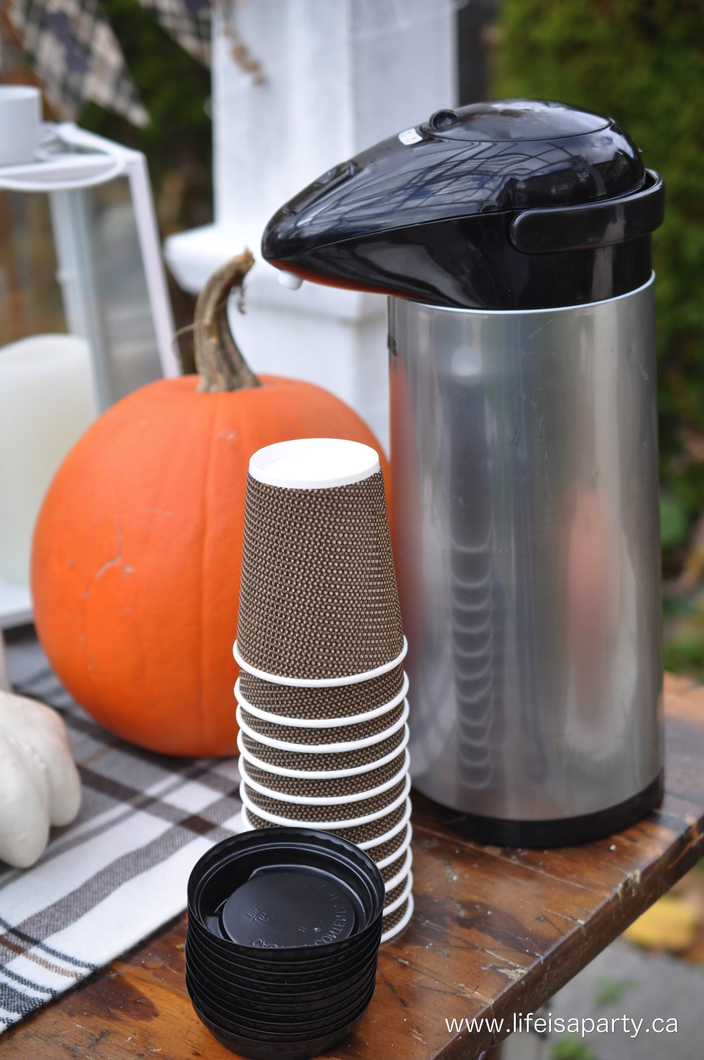 outdoor party drinks thermos with hot apple cider