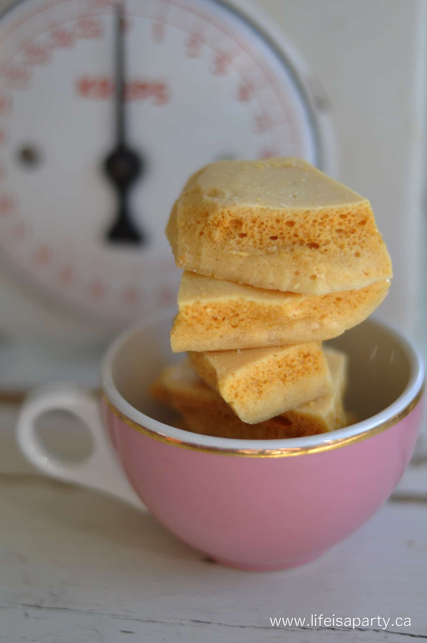 sponge candy stacked up in a pink tea cup