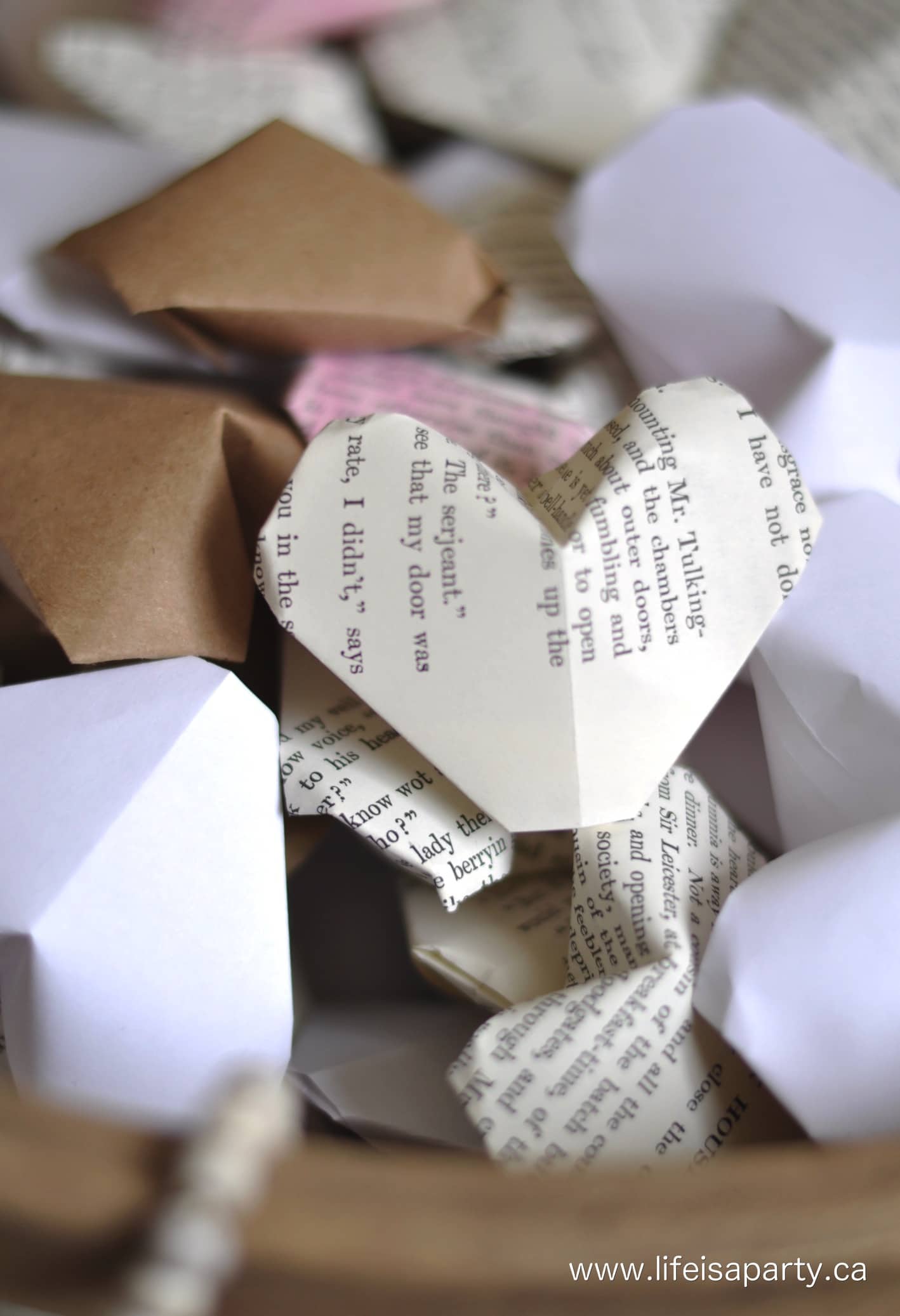 A 3d origami heart made from an old book page.