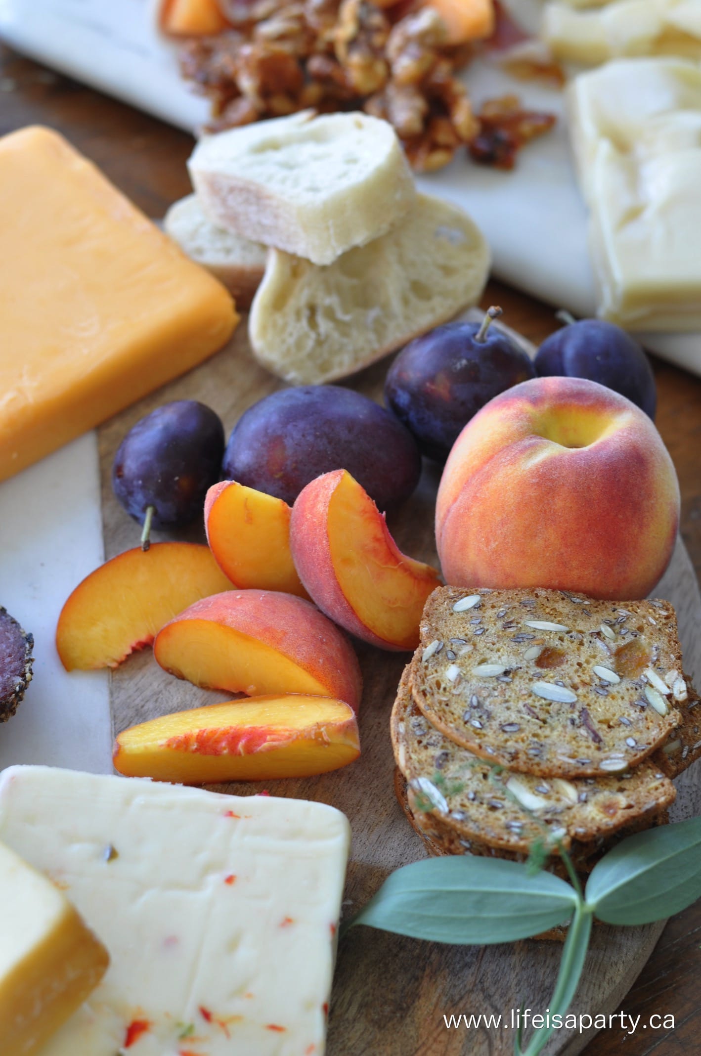 adding fruit to a cheese board