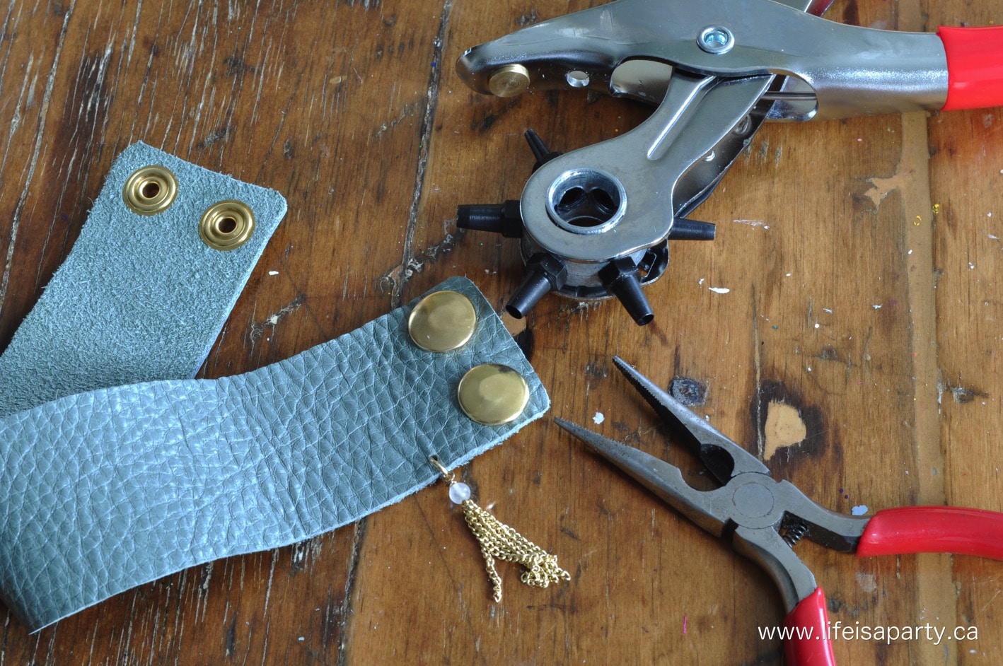 using a leather hole punch to make a leather cuff bracelet