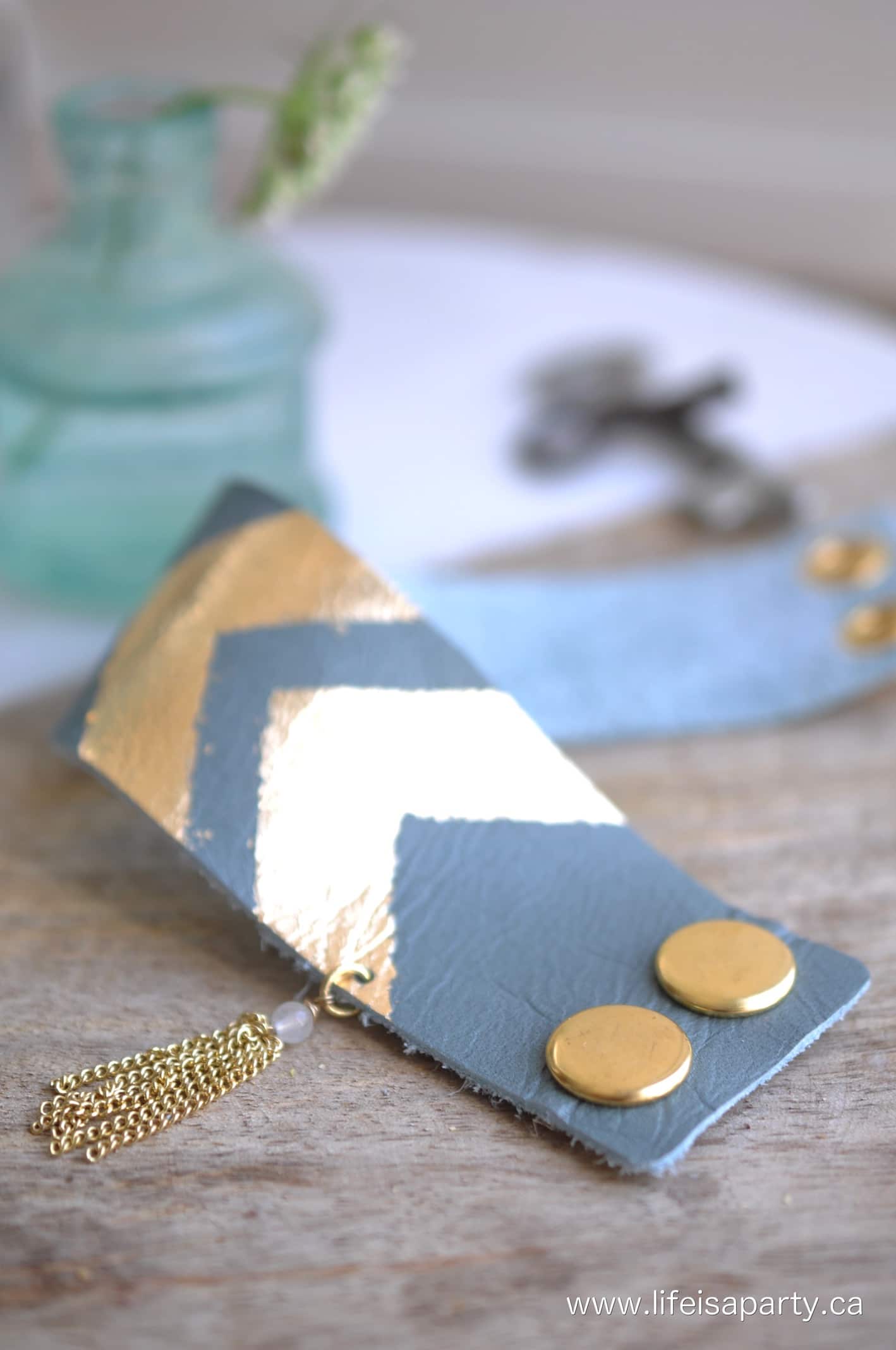 How To Make A Leather Cuff Bracelet: Create an amazing bracelet yourself, tutorial for adding snaps, gold leaf detail, and a tassel.
