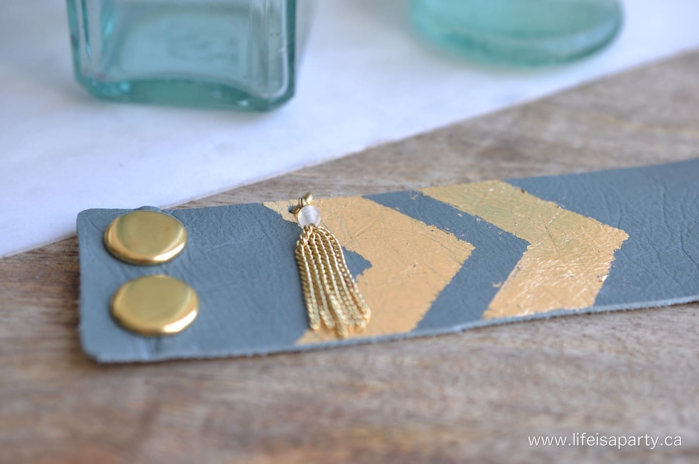 gold snap buttons on a diy leather cuff bracelet