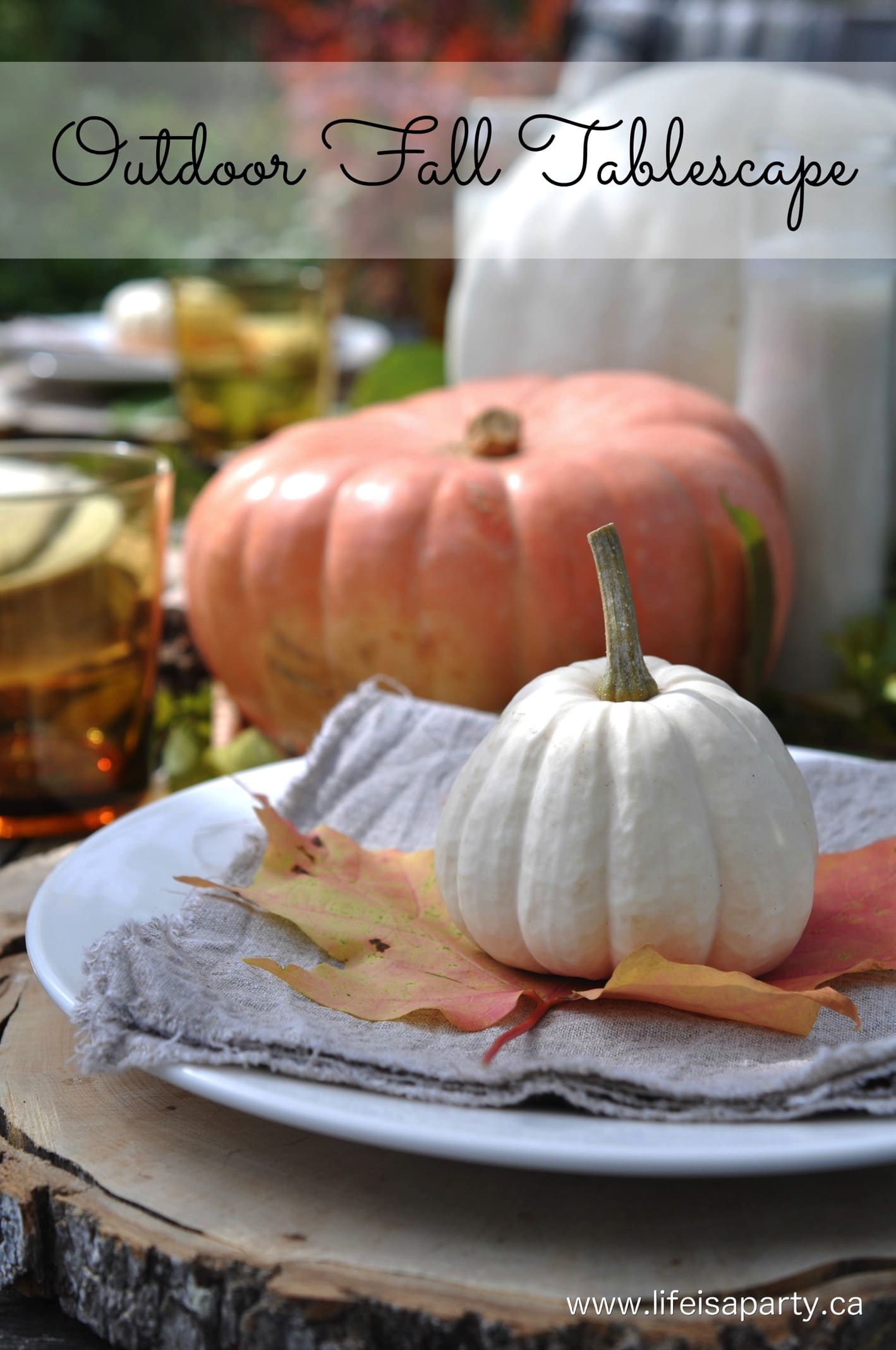 Outdoor Fall Tablescape: pretty pumpkins, leaves, lanterns, rustic wood, and cozy vintage plaid blankets make the perfect fall tablescape.