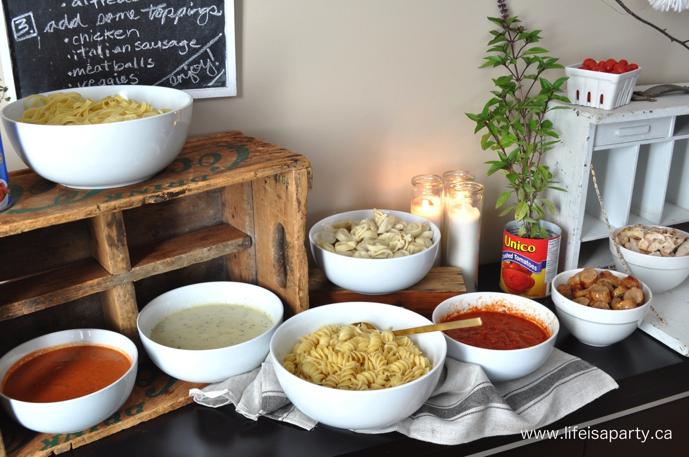 different pastas and sauces and toppings for a pasta buffet