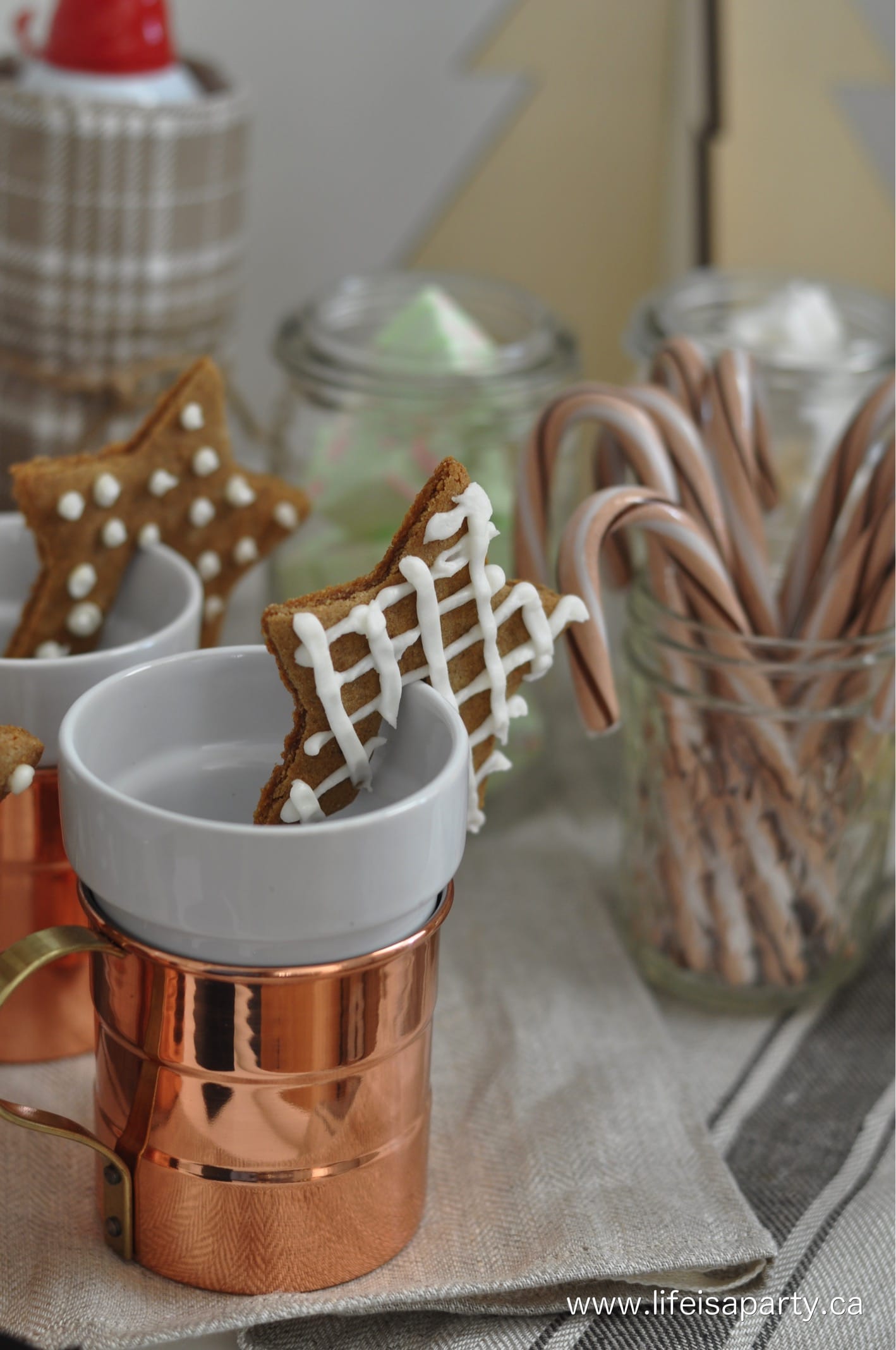 mugs with gingerbread cookies on the side