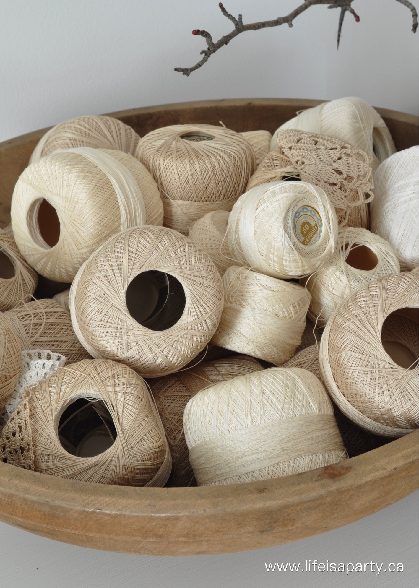 cotton thread in a wooden dough bowl