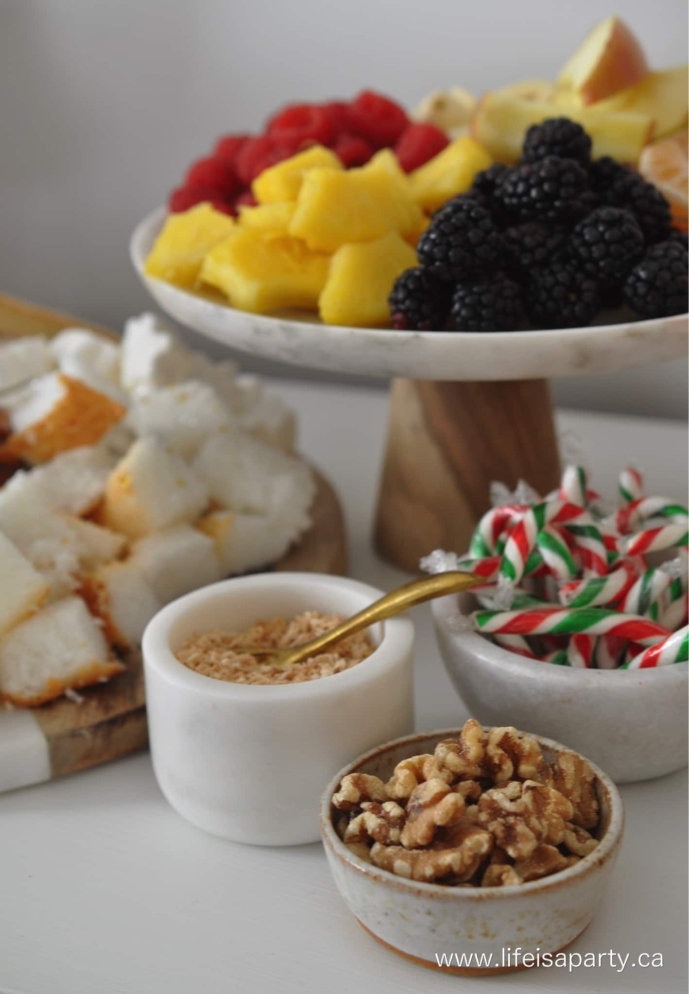 Dessert fondue dippers, included fruit, candy and nuts.