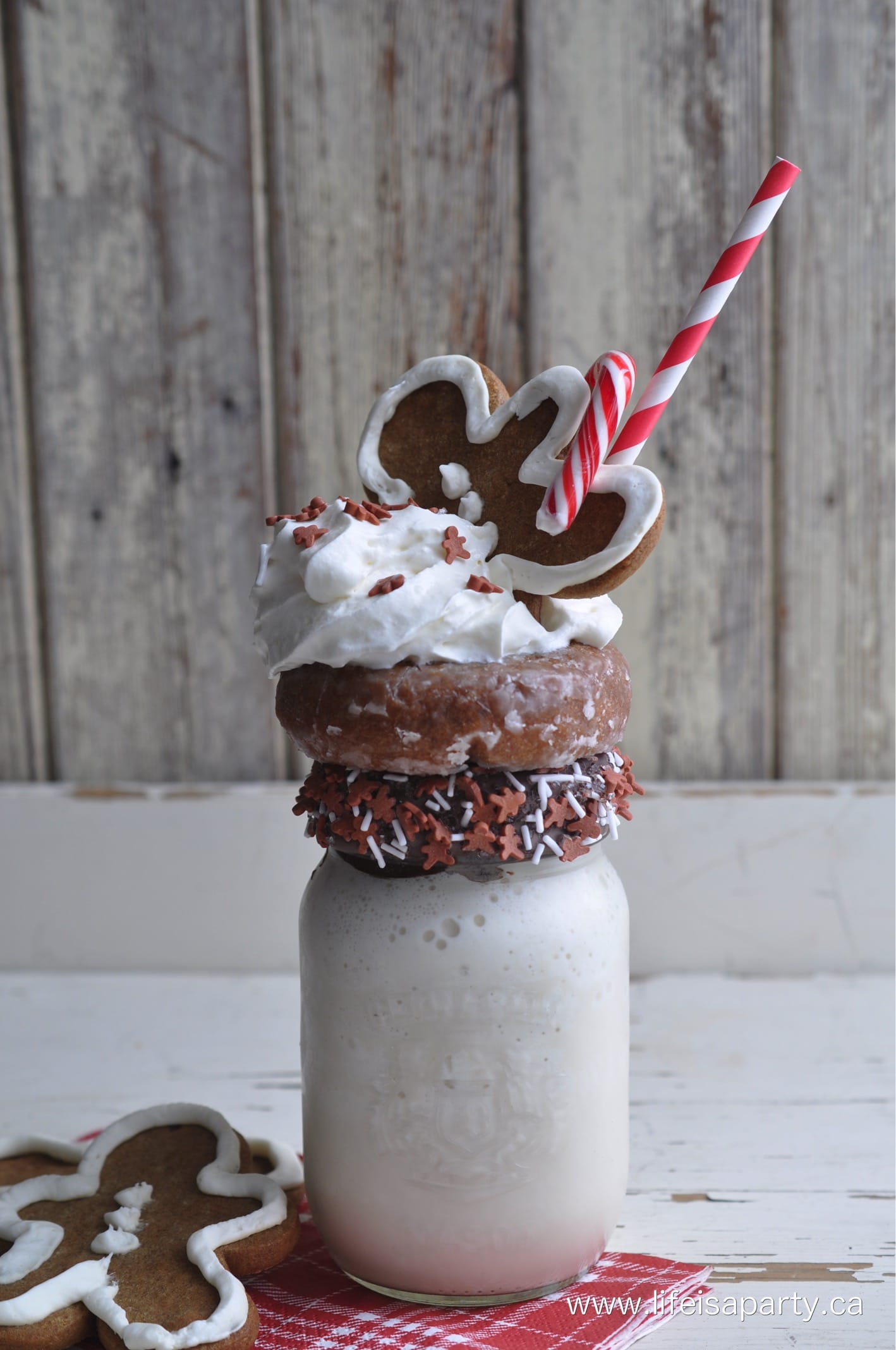 Gingerbread Extreme Milkshake with gingerbread donuts, whip cream, sprinkles, gingerbread man, and candy cane