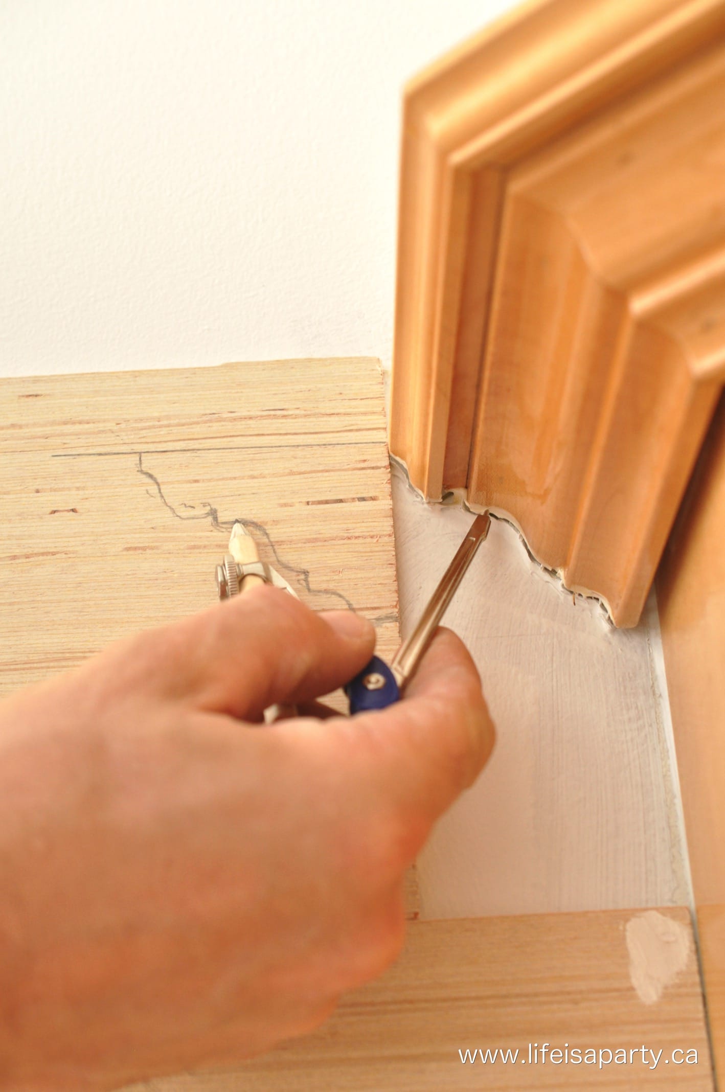 how use a compass to scribe around trim when you install shiplap