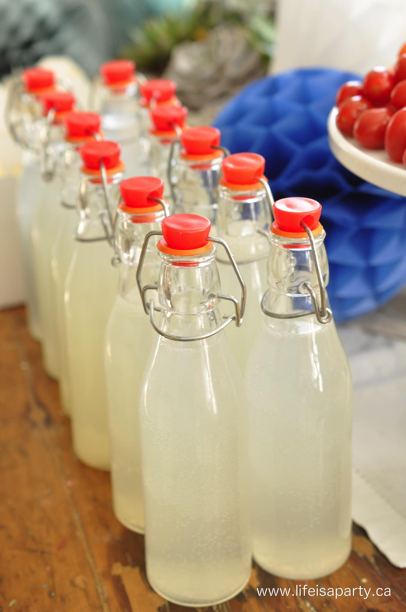 individual lemonade in reusable glass bottles