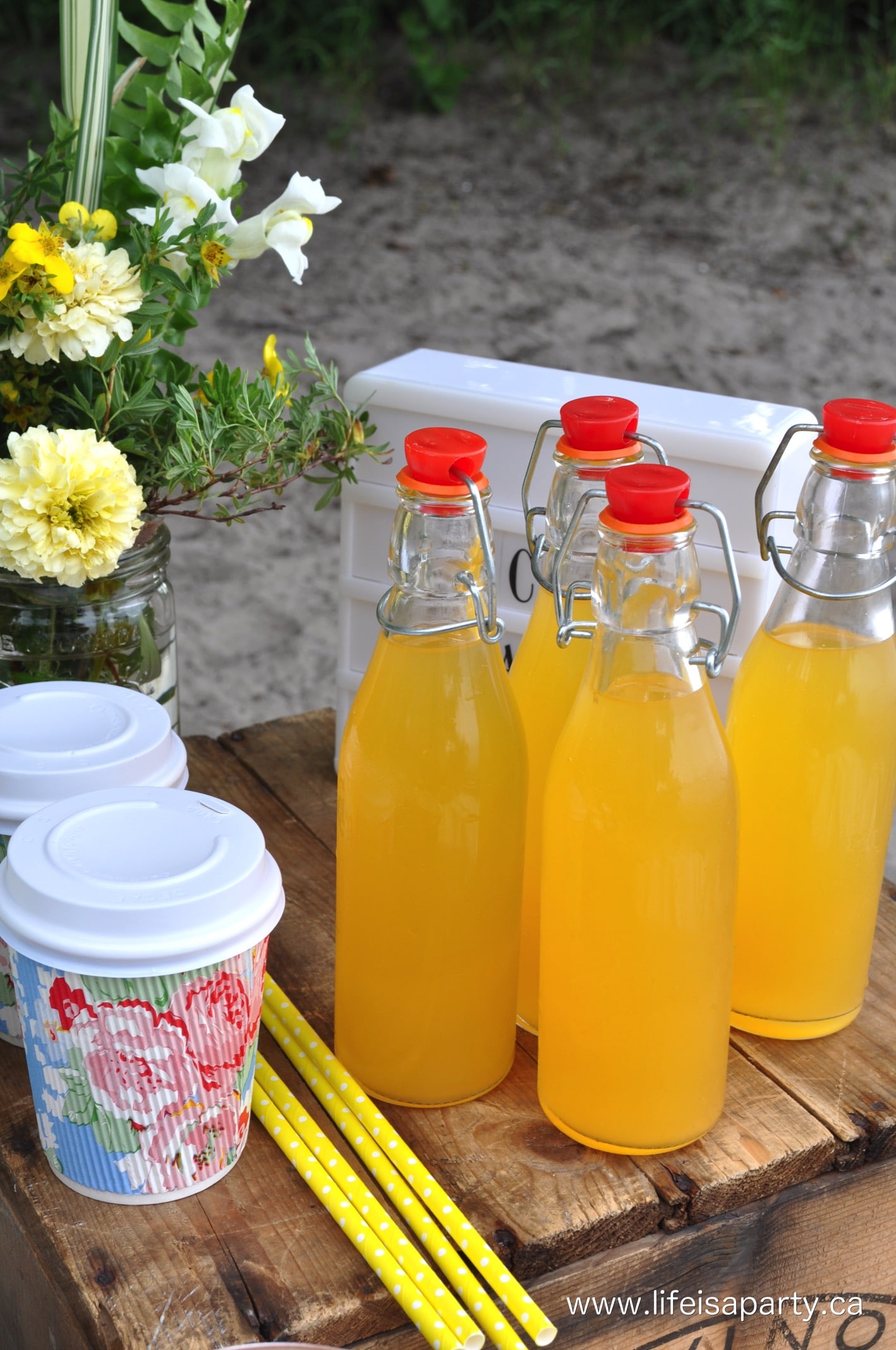 orange mango juice in glass bottles