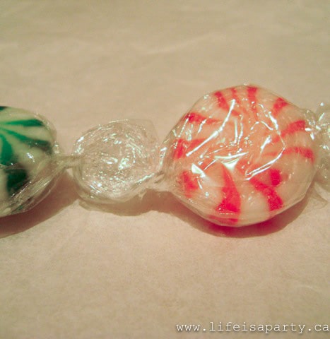 gluing peppermint candies together to make a Christmas Garland