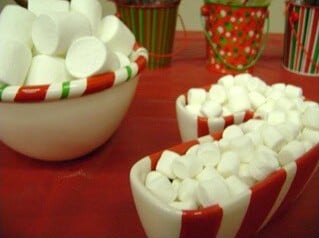 Bowls of marshmallows at a Christmas hot chocolate bar.