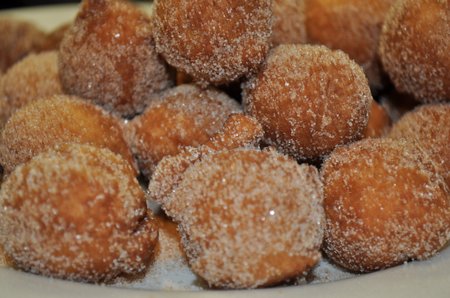 Sour Cream Donut Holes: these donuts are moist and delicious, and rolled in cinnamon sugar. They're the perfect treat for breakfast or dessert.