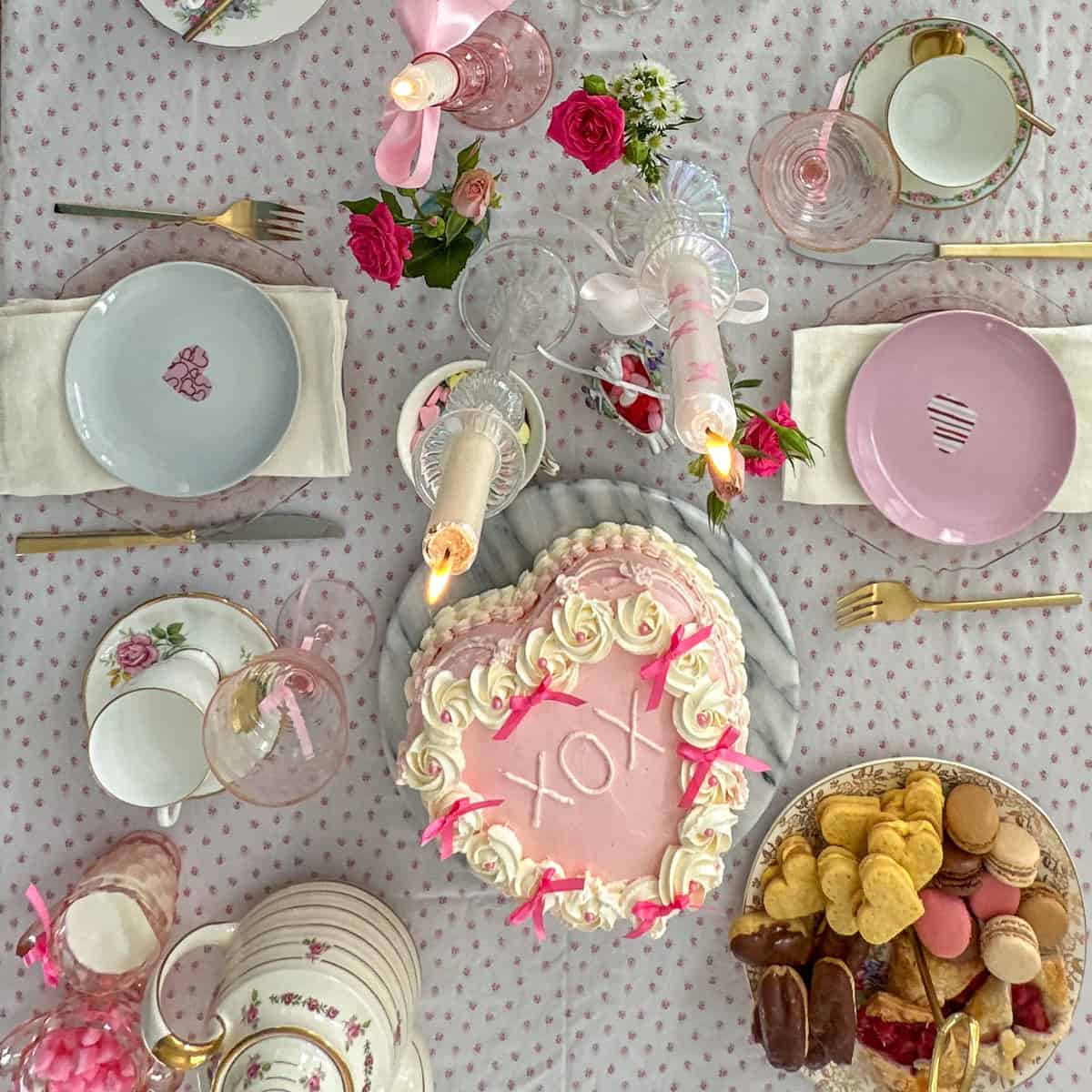 Galentine's Day tea party setup with coquette aesthetic decor and pink roses.