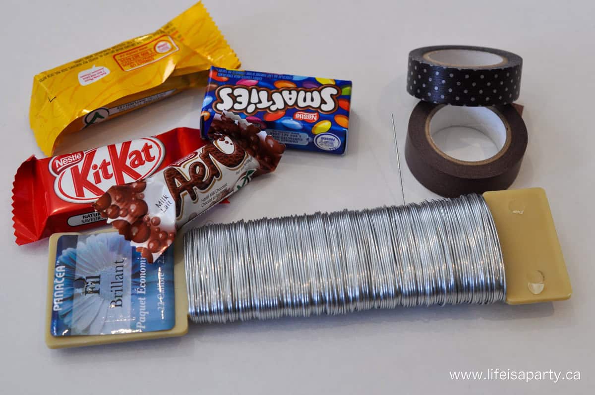 Making chocolate flowers with wire, mini chocolate bars and washi tape.
