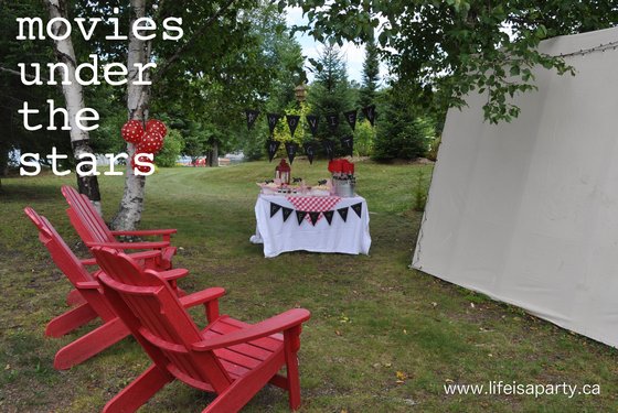 Outdoor Movie Night: Ideas for movies under the stars an outdoor movie night, with a popcorn buffet for snacks, and a red and white decorations.