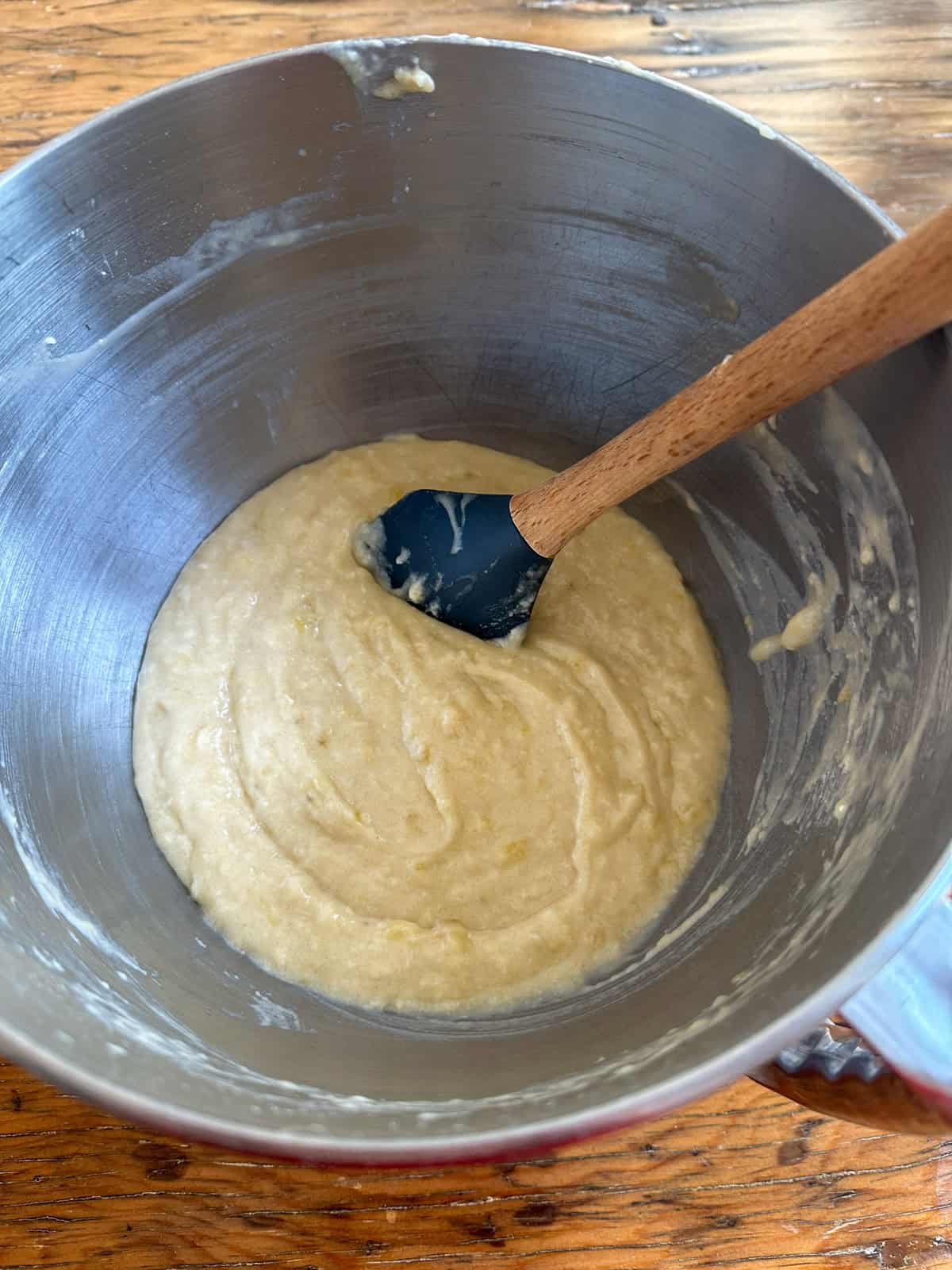 Banana snack cake batter in a stand mixer bowl.