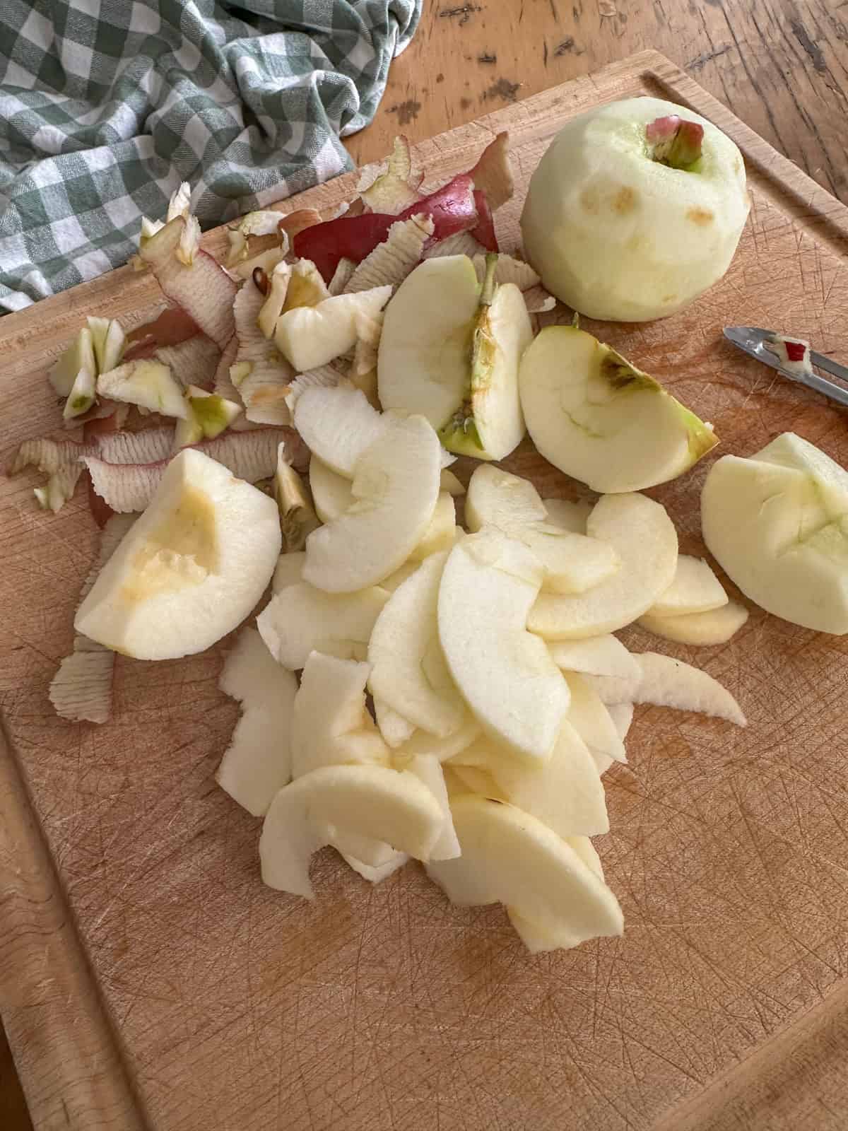 Apples peeled and slice for apple crisp.