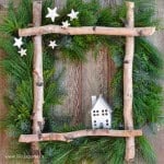 DIY birch wreath made with fresh greens and birch logs.