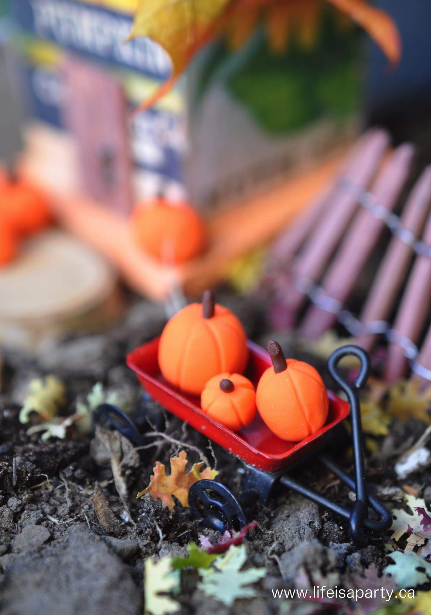 miniature polymer pumpkins in a miniature wagon
