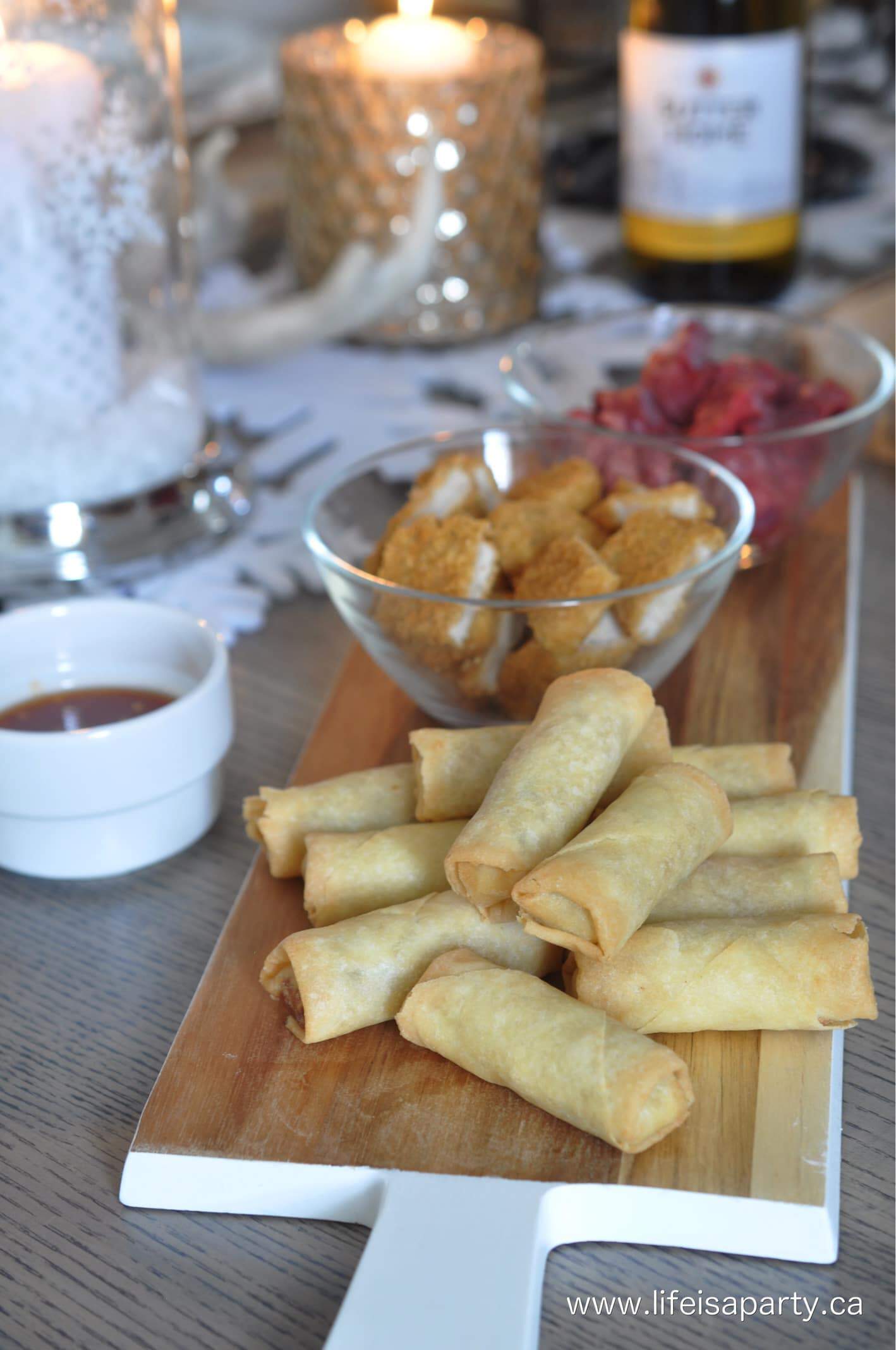 Beef, chicken, and egg rolls ready to cook in an oil fondue.
