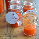 No cook hot sauce recipe in small jars with homemade labels.