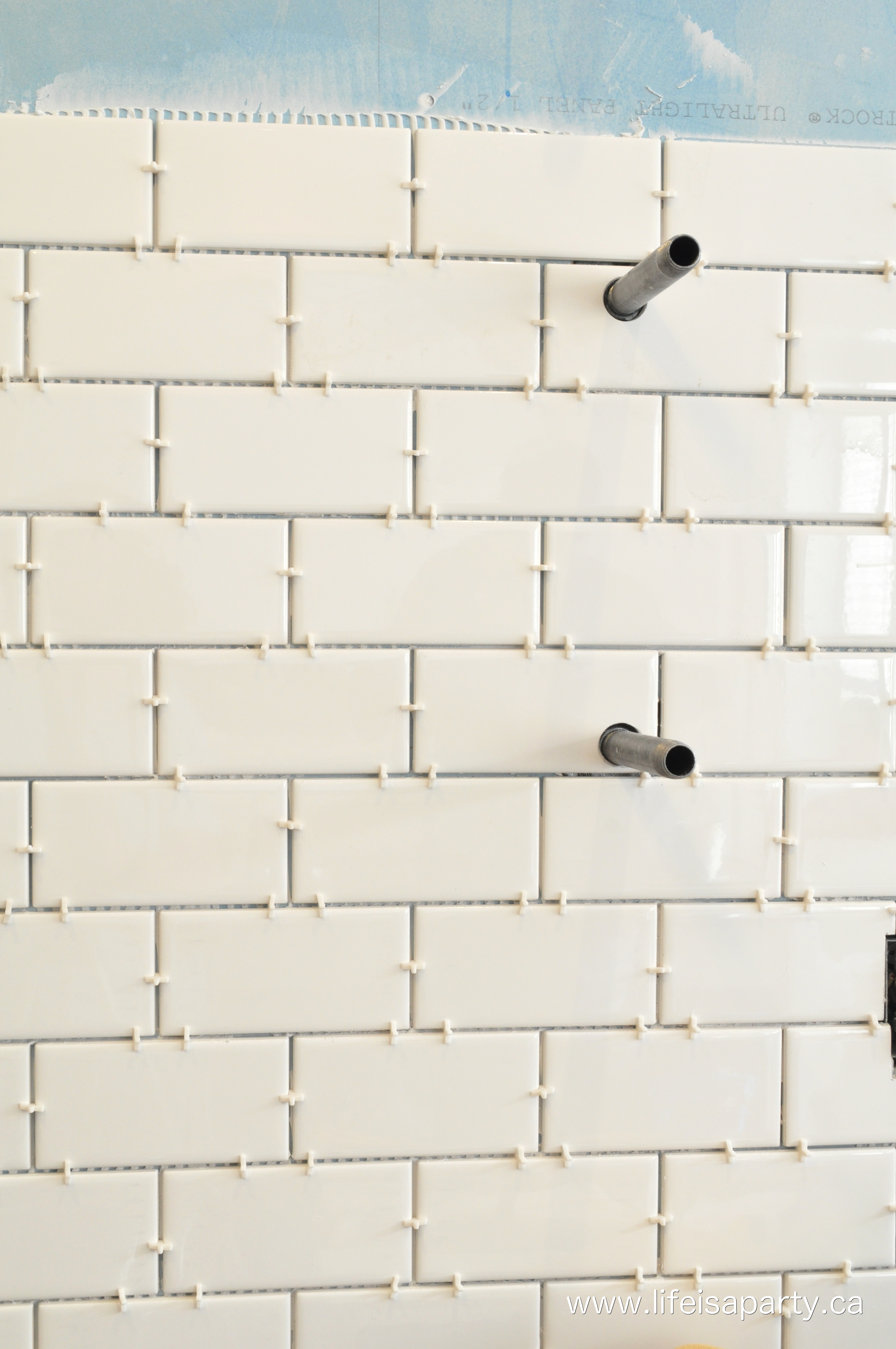 installing backsplash tile in a kitchen