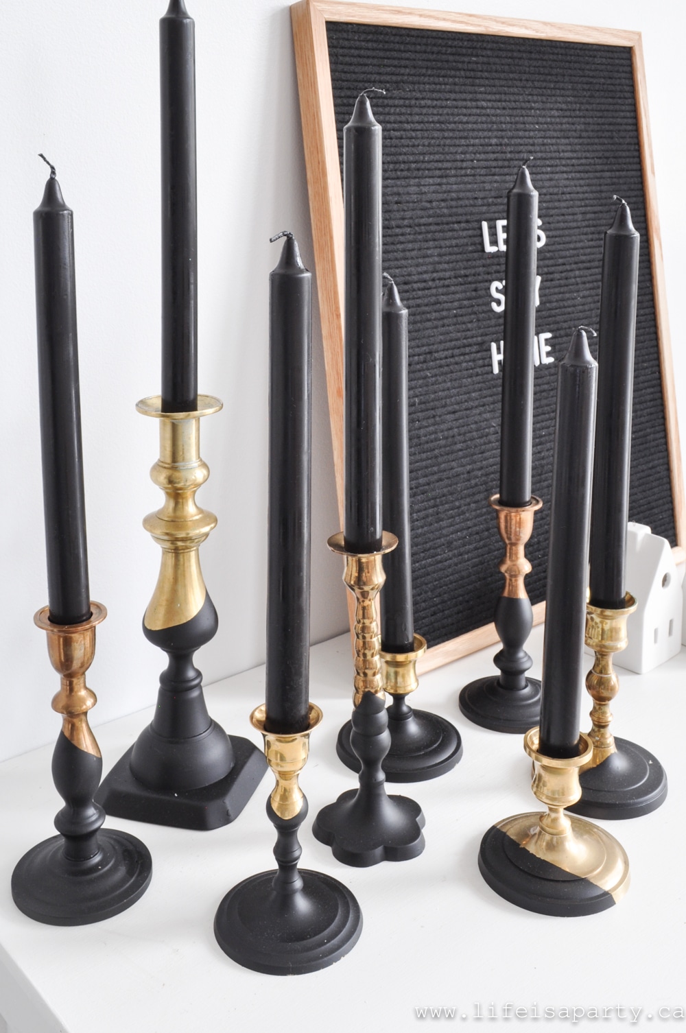 Black Paint Dipped Brass Candlesticks: update inexpensive thrift store brass candlesticks with matte black spray paint DIY