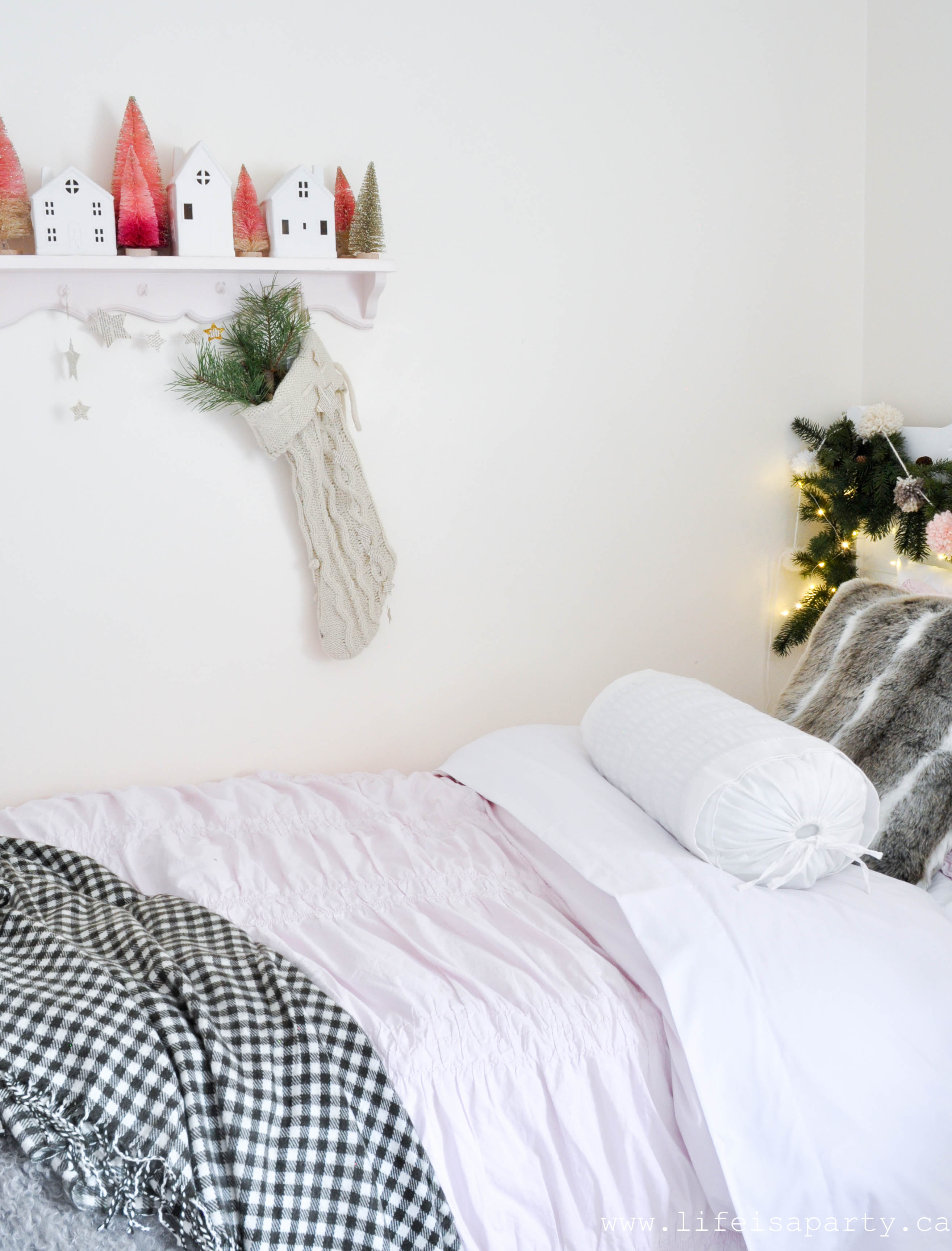 Little Girl's Christmas Bedroom -Add some coziness with warm throws, pom pom garland, and twinkle lights for any little girl's delight!