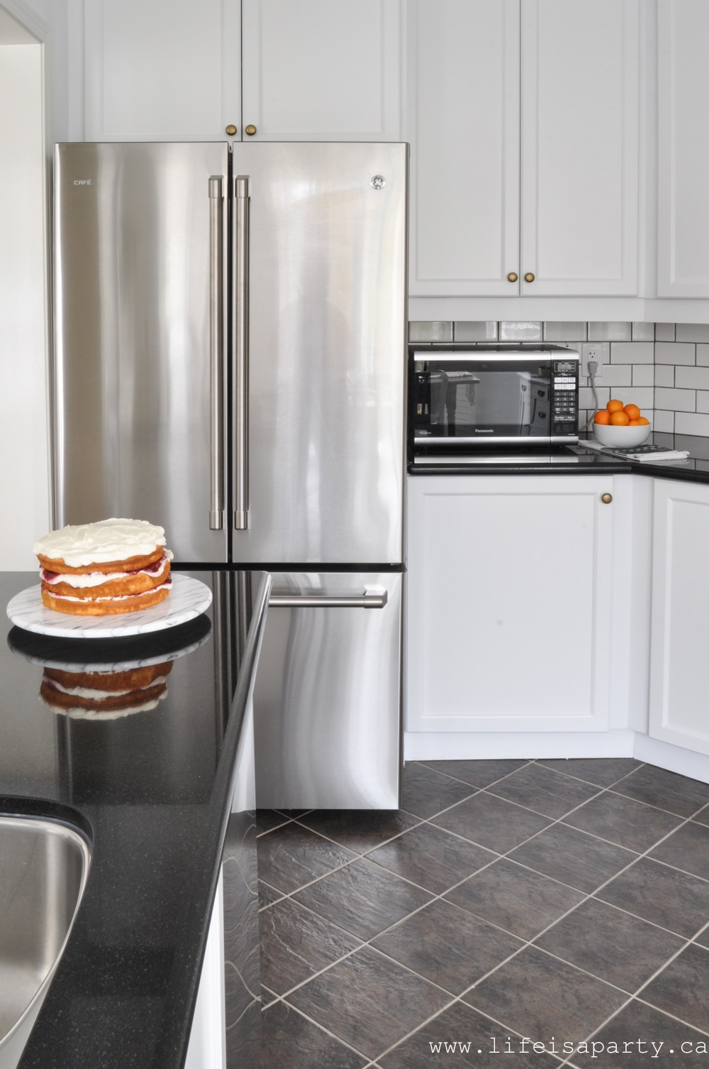 white kitchen cabinets and stainless steal appliances