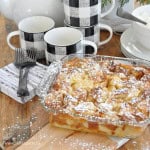 Eggnog bread pudding in a baking dish, ready to be served.
