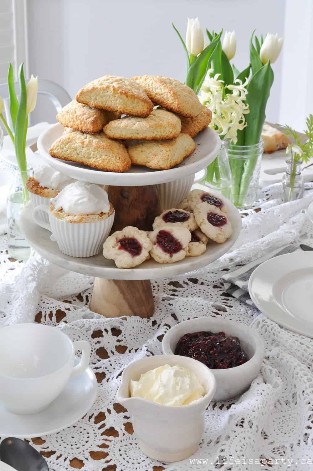 scones and tea party desserts on tiered tray
