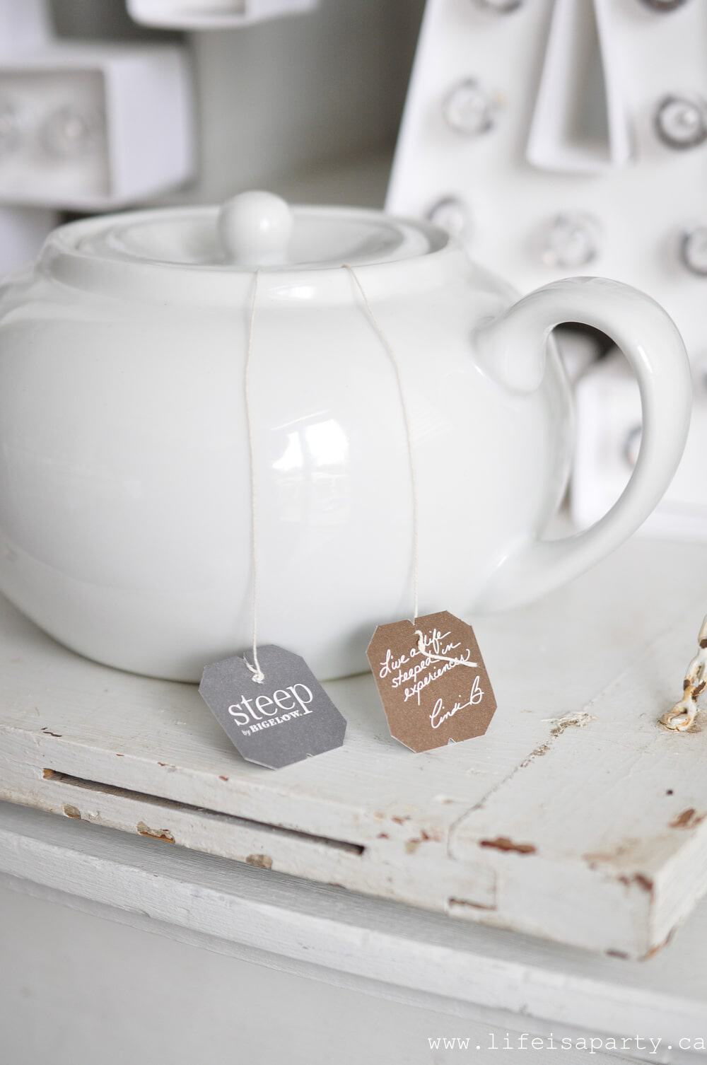 white tea pot with tea bags