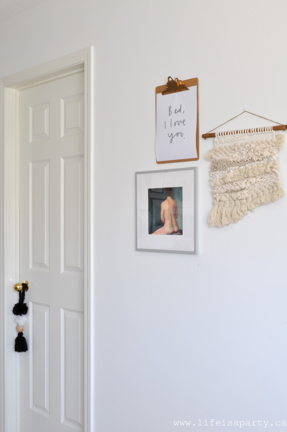 bedroom art grouping with woven wall hanging
